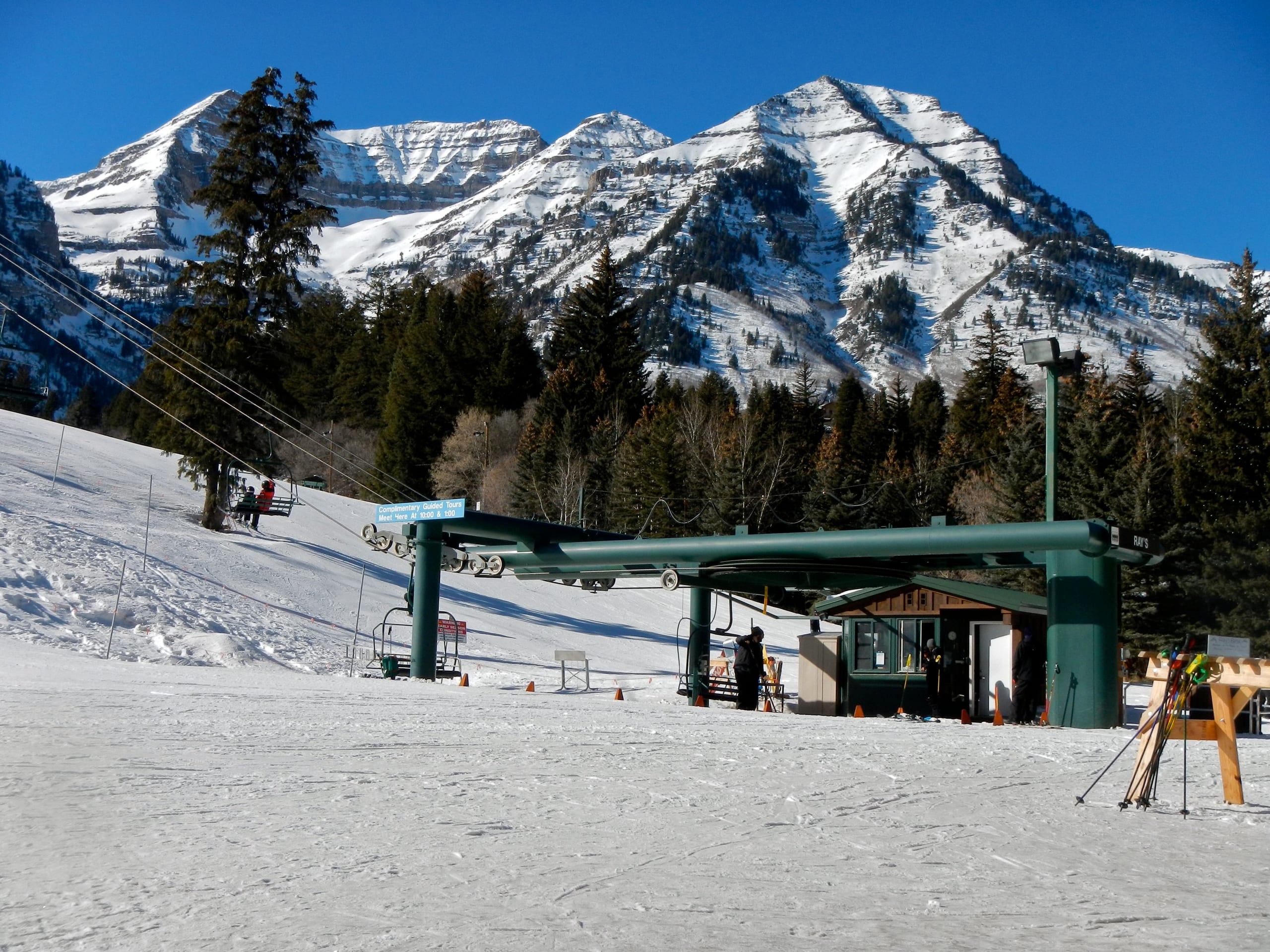 Chairlift base terminal and snow-covered slope at Sundance with Mount Timpanogos rising behind
